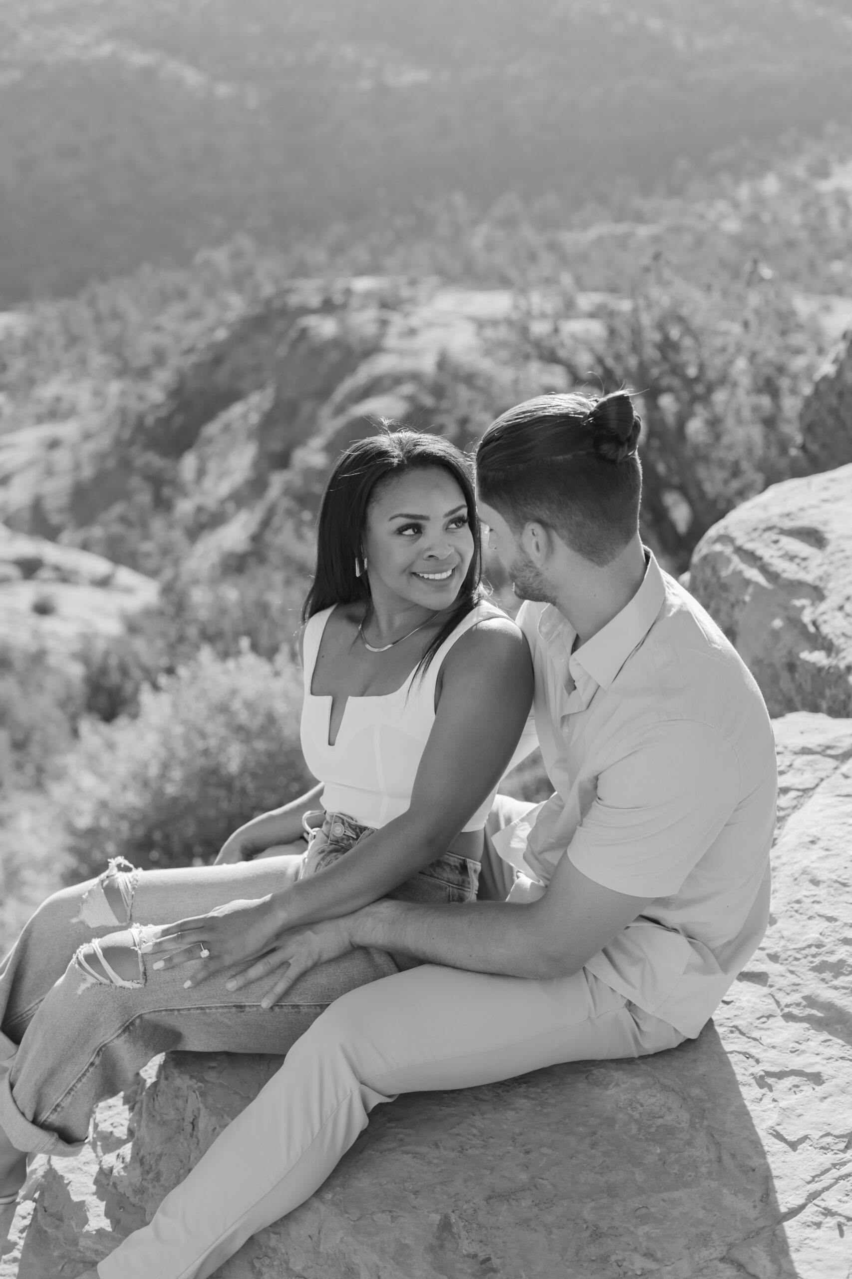 Photo of Lakin and Jasmyne at Sunrise:
"Lakin and Jasmyne stand together on top of Cathedral Rock in Sedona at sunrise, with the warm, golden light highlighting their joyful expressions and the stunning red rock formations in the background."