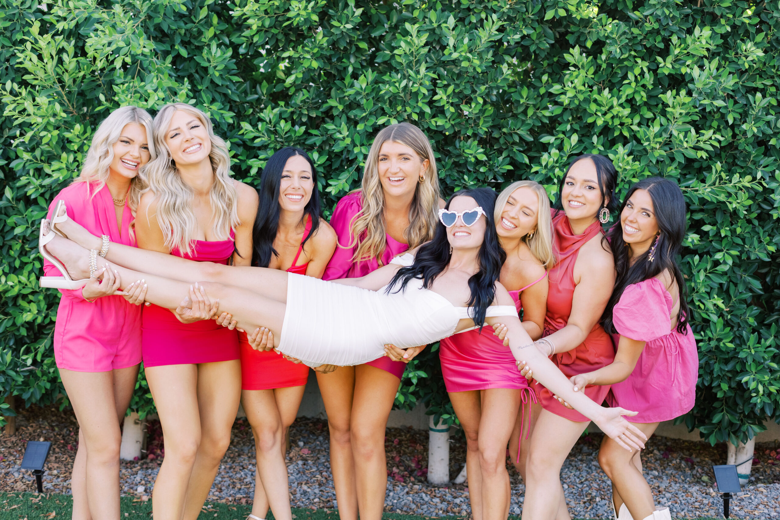 A group of friends enjoying a bachelorette weekend getaway in Scottsdale, Arizona, exploring the city and posing for photos with the bride.