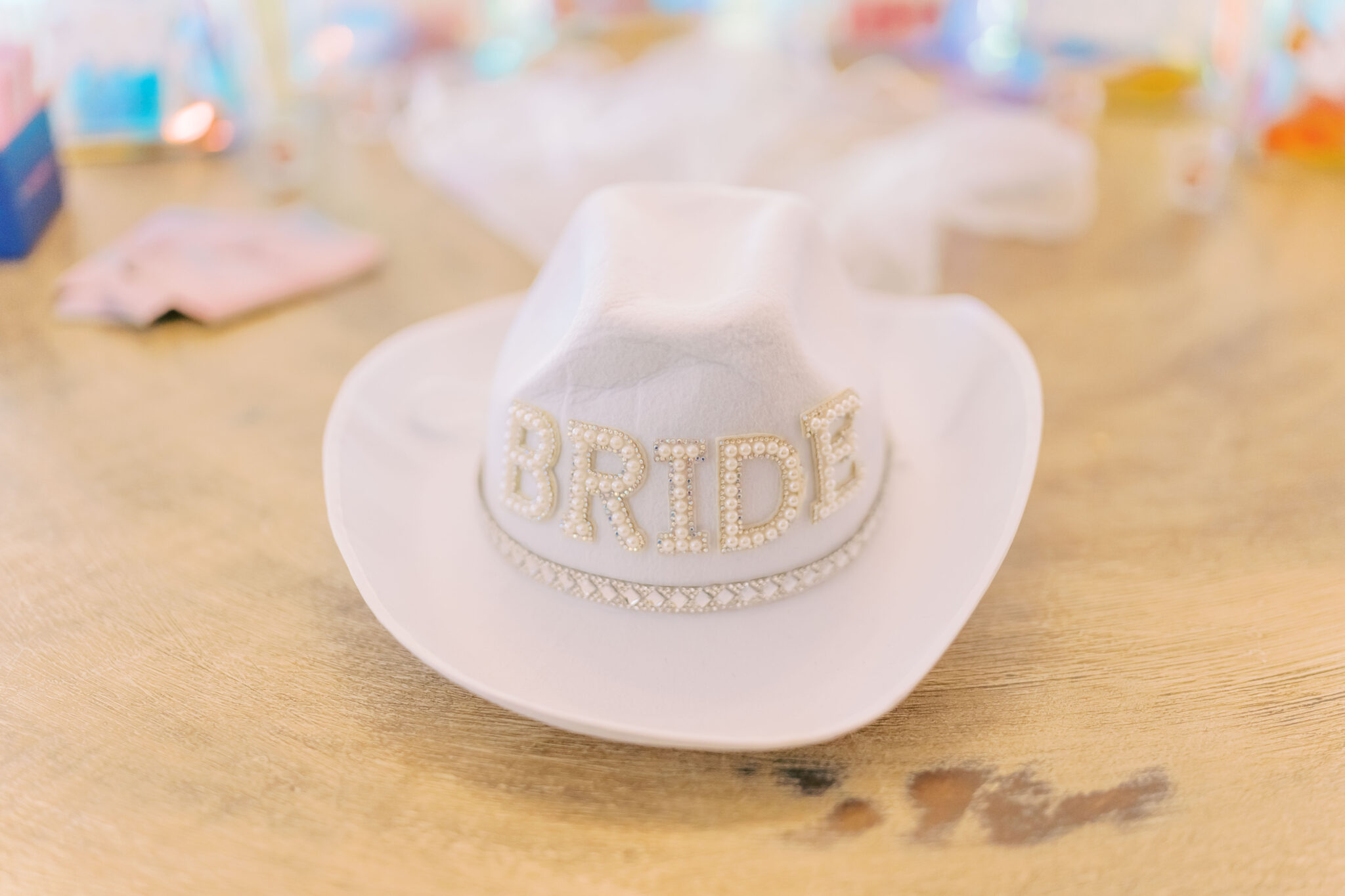 A white cowboy hat reads "BRIDE"